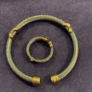 Silver and gold tone bracelet and ring.